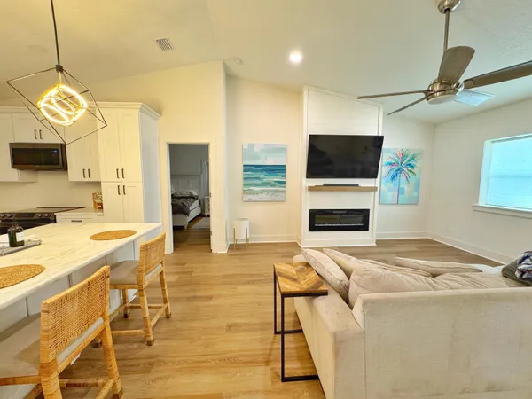 a living room with furniture and a flat screen tv