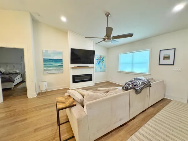 a view of living room kitchen with furniture and flat screen tv