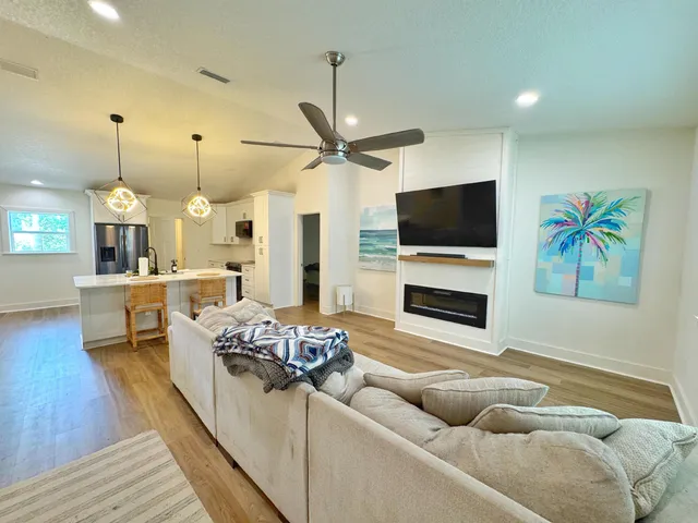 a living room with furniture and a flat screen tv