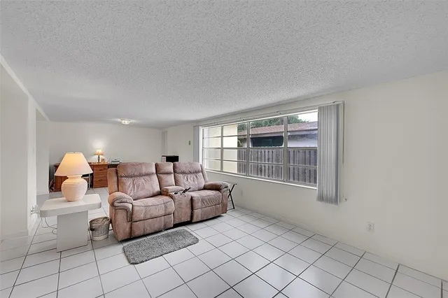 a bathroom with a sink mirror vanity and toilet