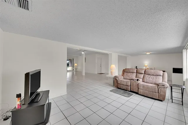 a bedroom with a bed and a table