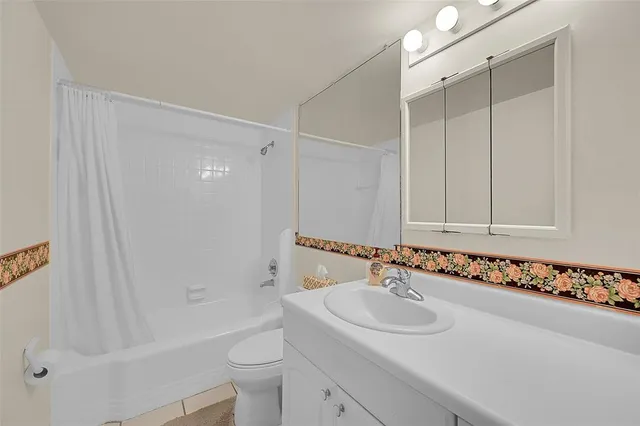 a view of backyard of house with green space