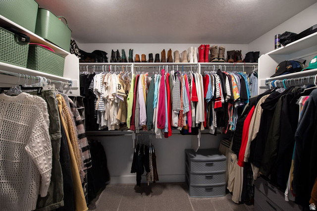 384 Ropelato Drive Nibley, UT 84321 - Photo 14 of 25 Built-in closet organization system with multiple shelving units and hanging rods, providing extensive storage options