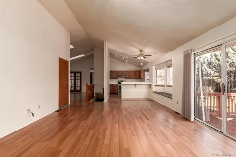 a view of a kitchen with wooden floor