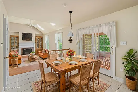 a view of a dining room with furniture window and outside view