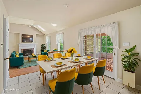 a view of a dining room with furniture window and outside view