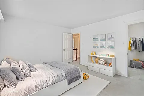 a bedroom with a bed and a closet
