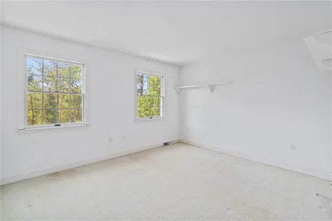 a bedroom with a bed and a table