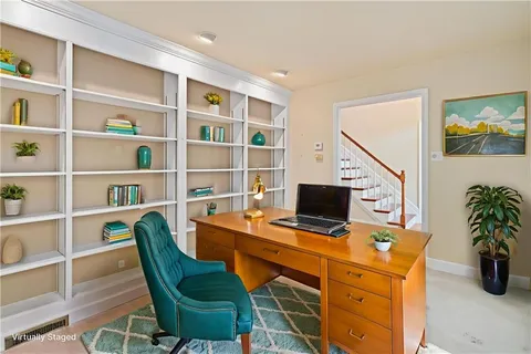 a view of a workspace with furniture