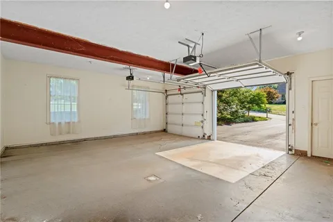 a balcony with wooden floor and trees in the back