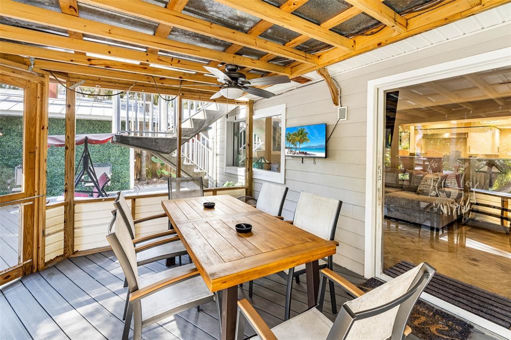 6110 Bear Trail Weeki Wachee, FL 34607 - Photo 20 of 48 a view of a patio with a table and chairs