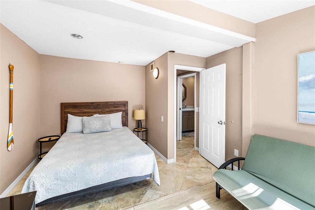 6110 Bear Trail Weeki Wachee, FL 34607 - Photo 25 of 48 a bedroom with a bed and a mirror