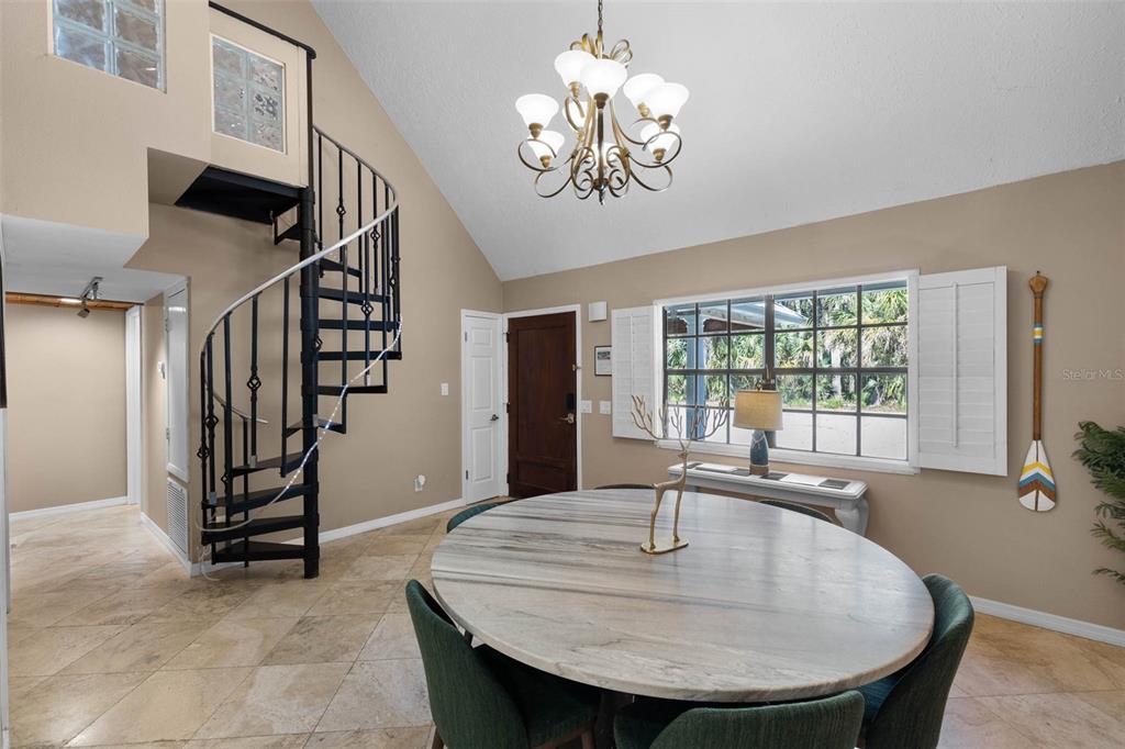 6110 Bear Trail Weeki Wachee, FL 34607 - Photo 28 of 48 a dining room with furniture entryway and wooden floor