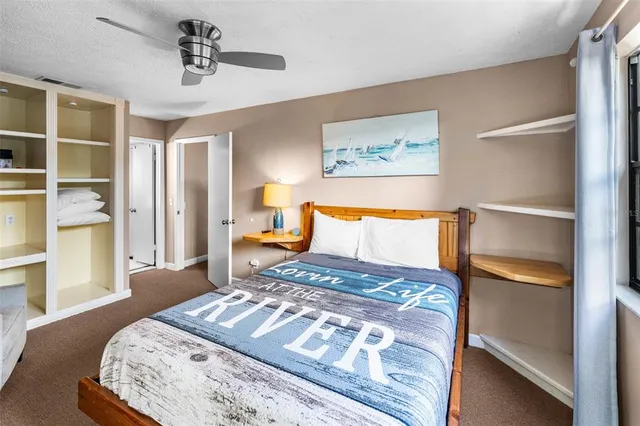 a bedroom with a bed and window