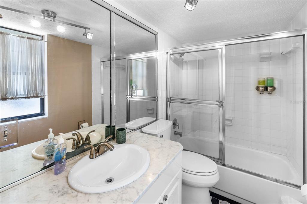 6110 Bear Trail Weeki Wachee, FL 34607 - Photo 31 of 48 a bathroom with a sink toilet and shower