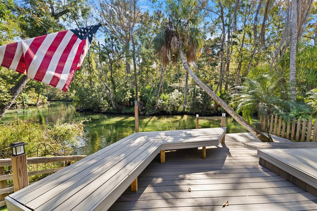 6110 Bear Trail Weeki Wachee, FL 34607 - Photo 6 of 48 a view of swimming pool with lounge chair and dinning tables