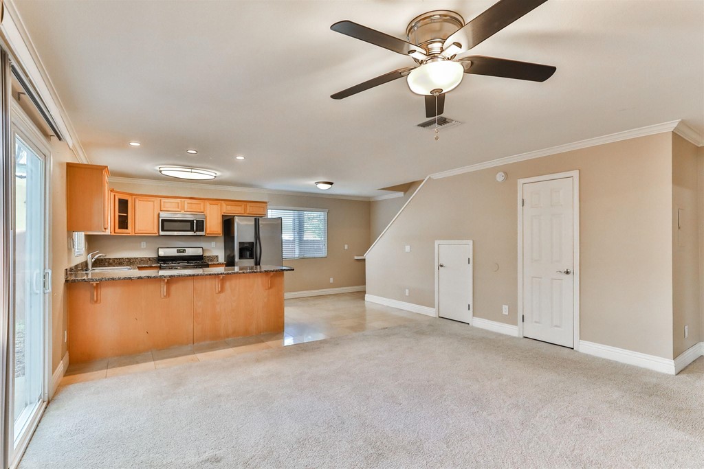 1133 Persimmon Avenue, Unit 7 El Cajon, CA 92021 - Photo 12 of 29 a view of kitchen with stainless steel appliances kitchen island microwave and stove