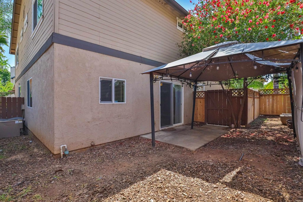 1133 Persimmon Avenue, Unit 7 El Cajon, CA 92021 - Photo 19 of 29 a view of a backyard with wooden fence
