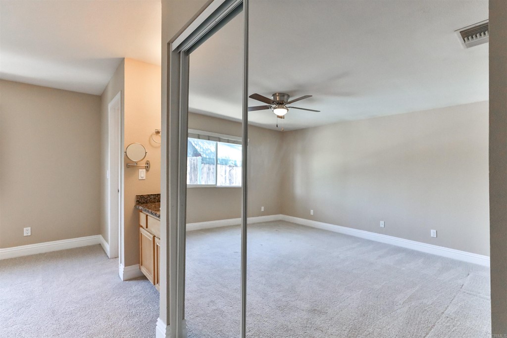 1133 Persimmon Avenue, Unit 7 El Cajon, CA 92021 - Photo 28 of 29 an empty room with windows and entrance