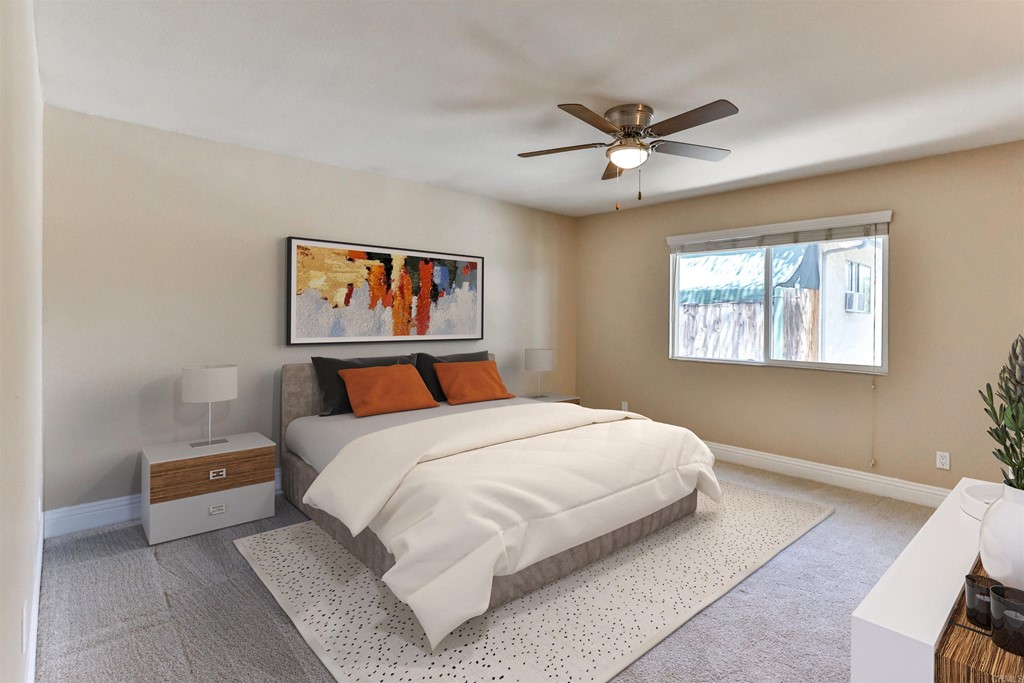 1133 Persimmon Avenue, Unit 7 El Cajon, CA 92021 - Photo 3 of 29 a bedroom with a bed and a painting on the wall