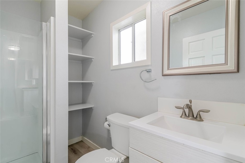 301 East Alameda Avenue, Unit A Burbank, CA 91502 - Photo 11 of 18 a white toilet sitting next to a bathroom sink