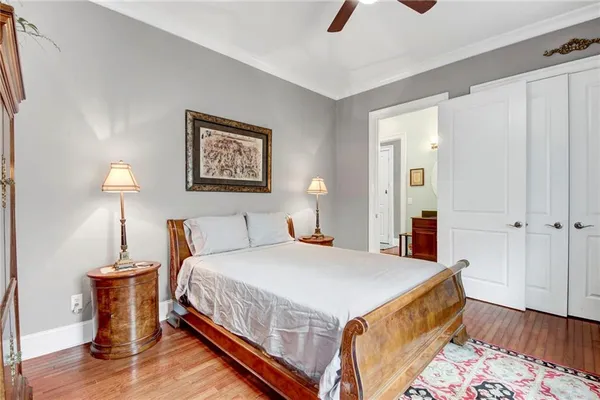 a bedroom with a bed and a lamp