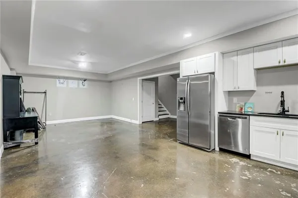 a kitchen with stainless steel appliances a refrigerator and a stove top oven