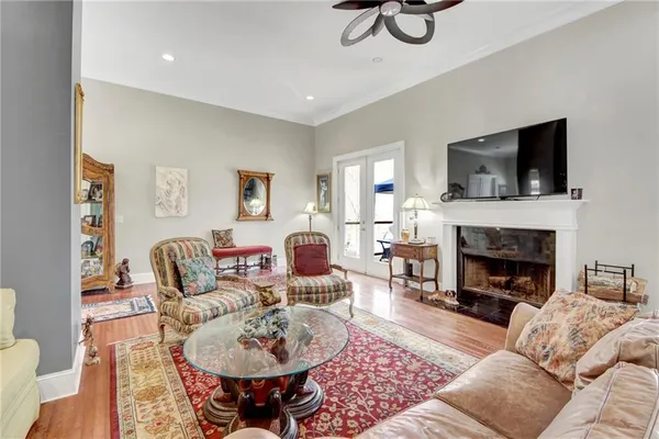 a living room with furniture fireplace and window