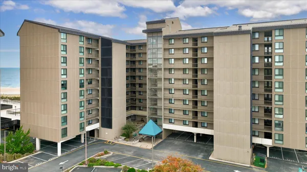 a front view of a building with glass windows