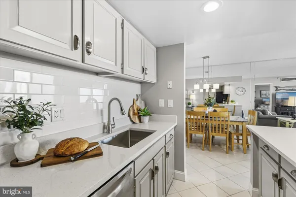 a kitchen with a sink and cabinets