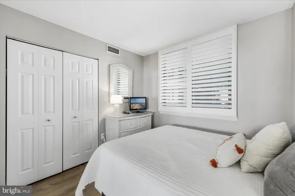 a bedroom with furniture and a table