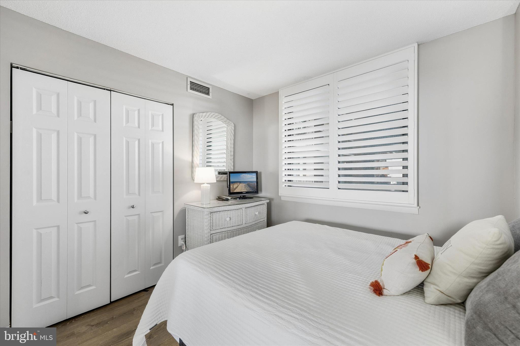 209 Georgetown House Road Bethany Beach, DE 19930 - Photo 31 of 57 a bedroom with a bed and a window