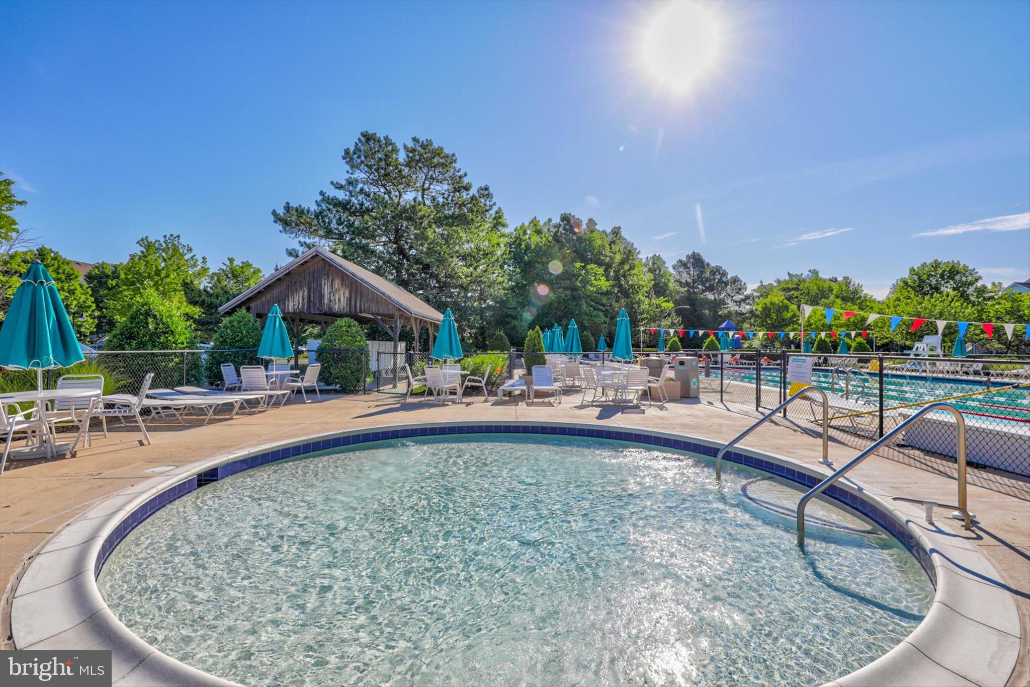 209 Georgetown House Road Bethany Beach, DE 19930 - Photo 49 of 57 swimming pool view with a seating space and a garden view