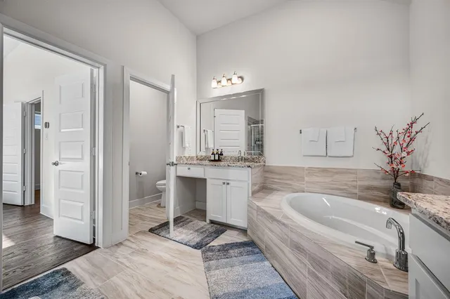 a bathroom with a shower and a sink