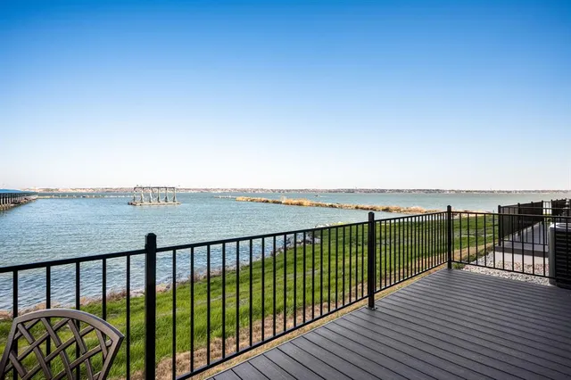 a view of balcony with wooden floor