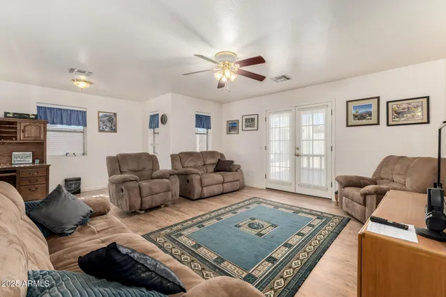 a living room with furniture rug and window