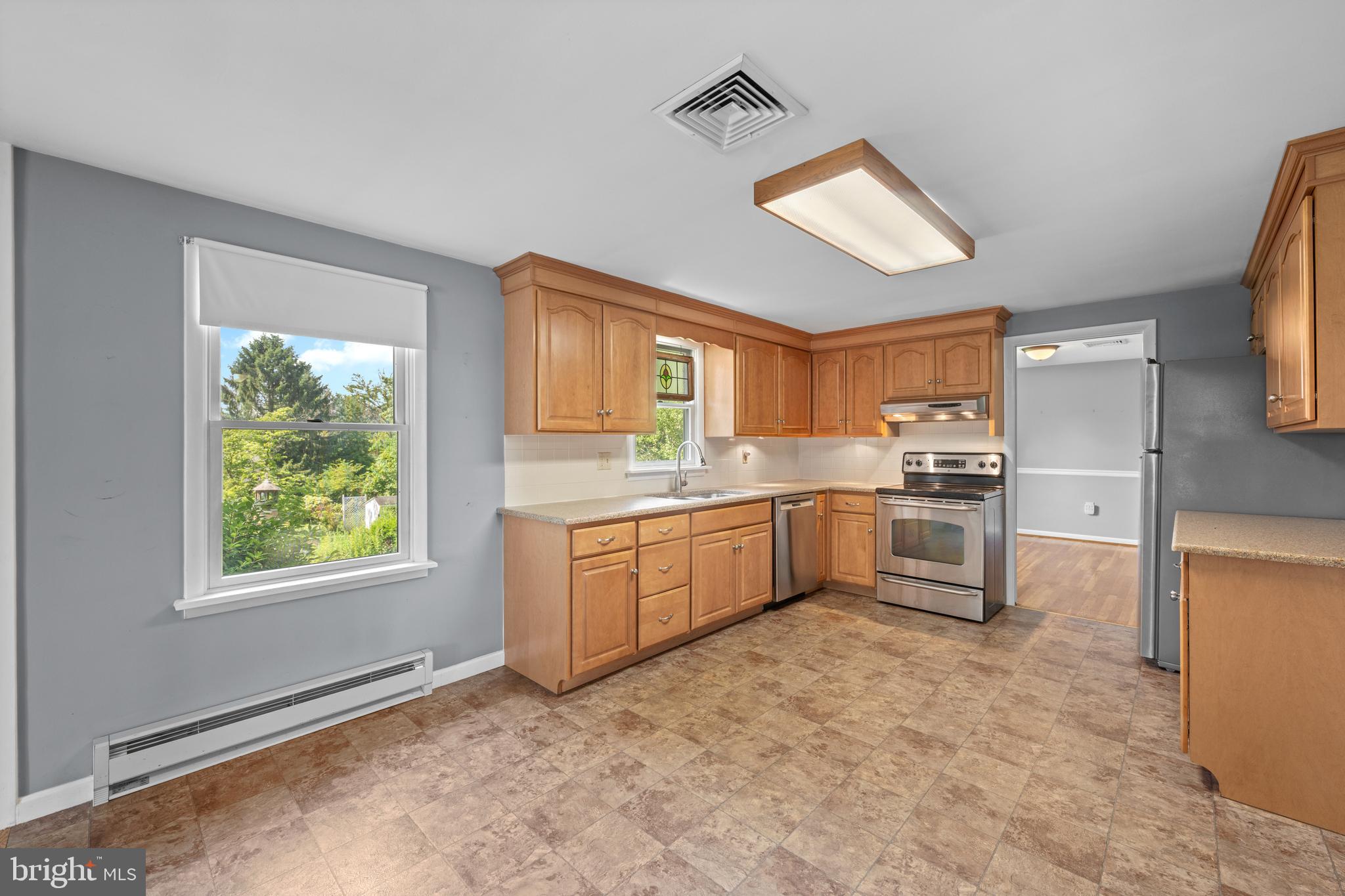 258 Monacy Road Coatesville, PA 19320 - Photo 20 of 54 a kitchen with granite countertop a window and a refrigerator