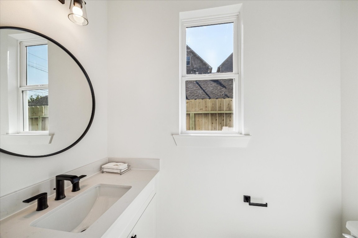 5337 Larkin Street Houston, TX 77007 - Photo 18 of 37 Beautiful powder room with built in cabinet and quartz counter top.