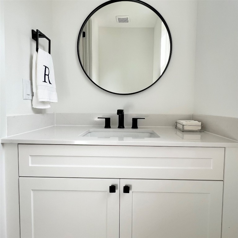 5337 Larkin Street Houston, TX 77007 - Photo 19 of 37 Sleek and classic design make this one luxurious powder room.