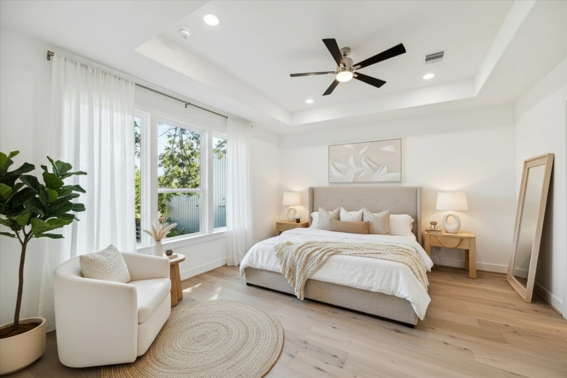 5337 Larkin Street Houston, TX 77007 - Photo 21 of 37 This spacious primary bedroom is the perfect combination of comfort, style, and sophistication.