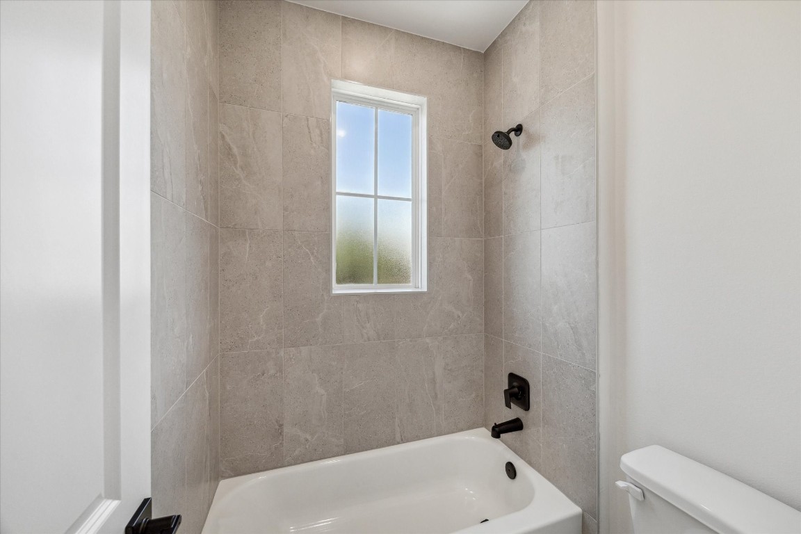 5337 Larkin Street Houston, TX 77007 - Photo 27 of 37 A chic and modern design with stunning tile work that elevates the entire bathroom.