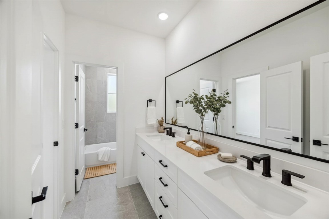 5337 Larkin Street Houston, TX 77007 - Photo 30 of 37 A stunning contrast of clean lines and intricate tile designs gives this bathroom a refined elegance.