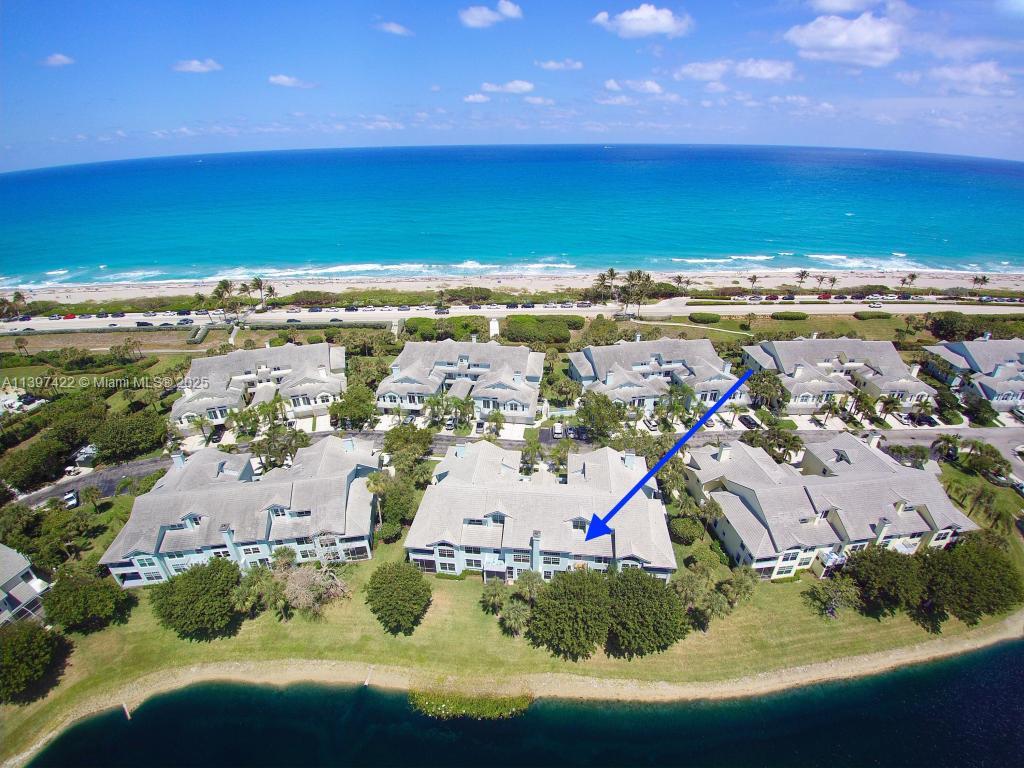 905 Mainsail Circle, Unit 905 Jupiter, FL 33477 - Photo 1 of 27 an aerial view of residential houses with outdoor space