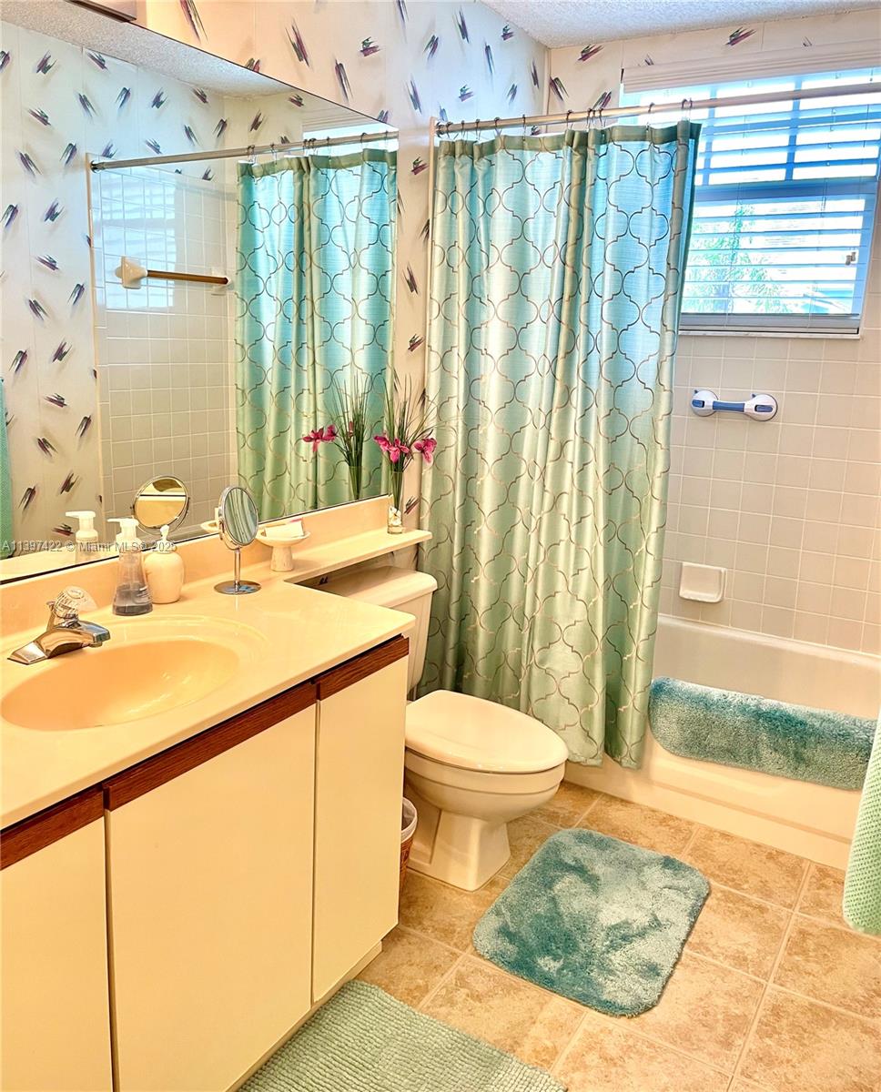 905 Mainsail Circle, Unit 905 Jupiter, FL 33477 - Photo 15 of 27 a bathroom with a sink toilet and shower
