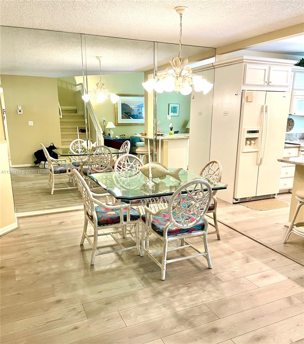 905 Mainsail Circle, Unit 905 Jupiter, FL 33477 - Photo 4 of 27 a dining room with furniture and window