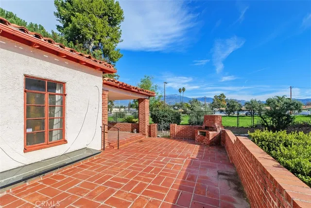 a view of a patio with a yard
