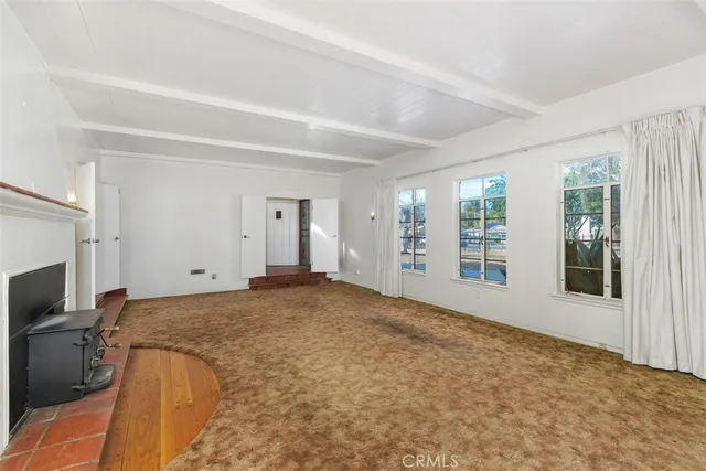 a white kitchen with sink and white appliances