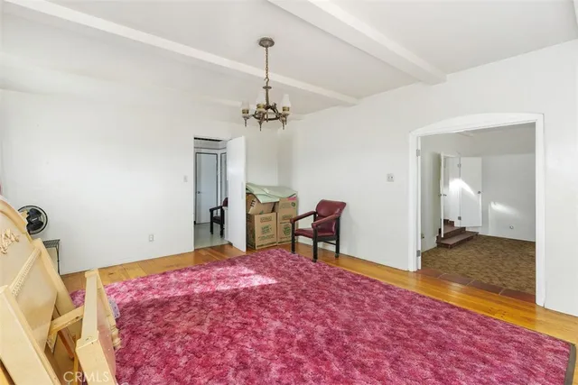 a kitchen with stainless steel appliances kitchen island granite countertop a sink and a microwave