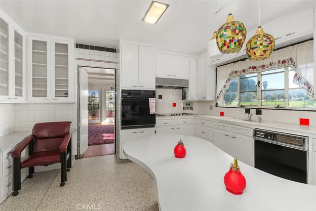 a room with a bed and a flat screen tv