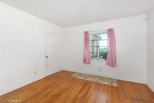 a view of an empty room with windows